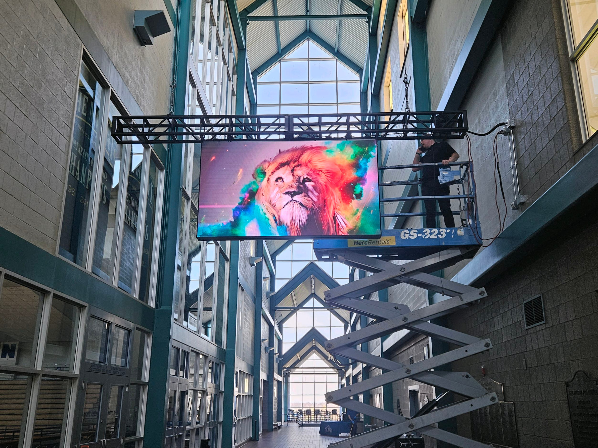 LED wall rigged in a stadium atrium