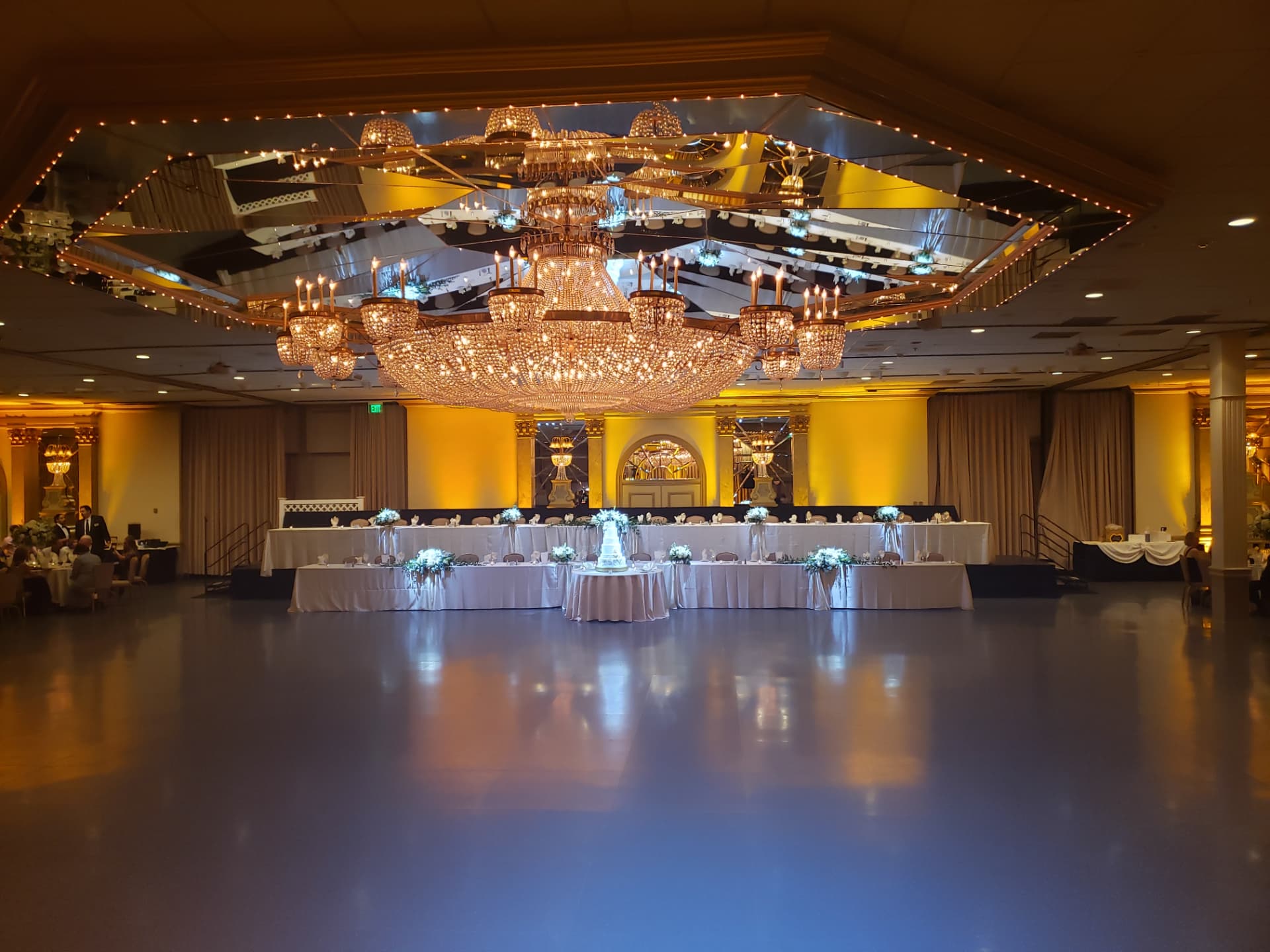 Amber uplighting under the chandeliers