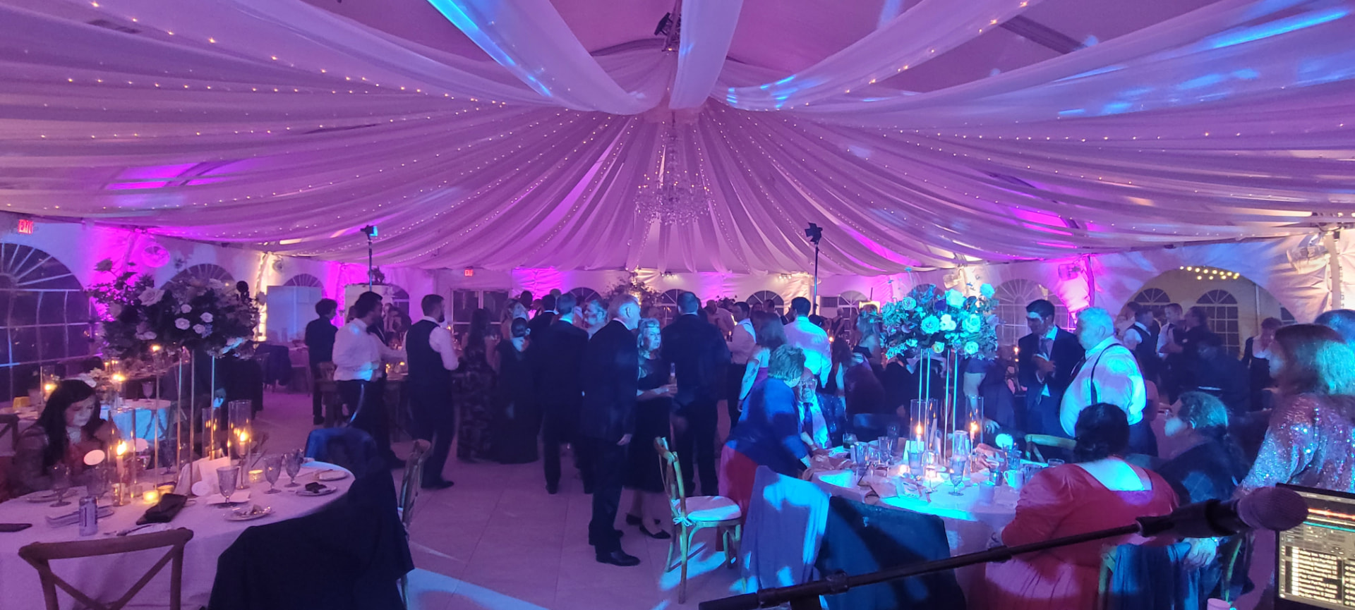 Tent reception lit in purple and teal