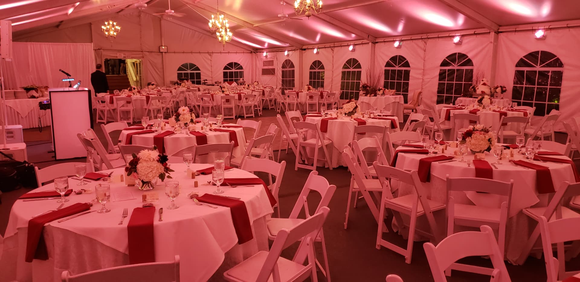 Tented reception in a blush uplight wash
